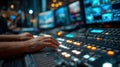 Close-Up of Hands Operating Control Panel in Television Studio with Blurred Newsroom Background Royalty Free Stock Photo