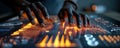Close-up of hands operating a futuristic touchscreen interface with orange neon data visuals Royalty Free Stock Photo