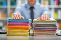 Close-up of Hands Organizing Documents on a Work Desk Royalty Free Stock Photo