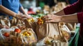 Close-up of hands packing food donations for a local food bank