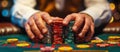 A close-up of the hands of a player at the table making a bet with playing chips. A poker game. Panoramic banner. Royalty Free Stock Photo