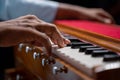 Close up of Hands playing Harmonium or reed organ an Indian classical music instrument. Royalty Free Stock Photo