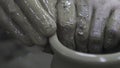 Close up of hands of a potter while creating a clay jar, ceramics production concept. Stock footage. The sculptor male