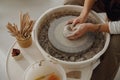 Close up of hands of professional potter molding pot shape on pottery wheel. Ceramics art concept Royalty Free Stock Photo