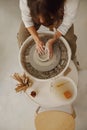 Close up of hands of professional potter molding pot shape on pottery wheel. Ceramics art concept Royalty Free Stock Photo