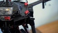 Close up for hands putting battery into the quadcopter, filming preparation. Clip. Drone setup, inserting accumulator