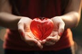 Close-up of hands releasing heart - stock photography concepts
