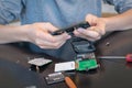 Close up of hands repairing a mobile phone