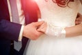Close-up of hands of romantic couple holding together during wedding ceremony Royalty Free Stock Photo