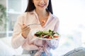 Close up of hands with salad of Caucasian female. Royalty Free Stock Photo