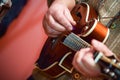 Close up hands senior man playing mandolin Royalty Free Stock Photo