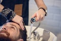 Close-up of the hands of a skilled hairdresser giving a hair wash