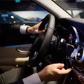 Close up hands on steering wheel. Shallow dof