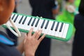 Close up hands of students playing melodian marching band the music you learned in high school Royalty Free Stock Photo