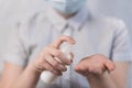 Close-up hands teenage child, antiseptic spray protection bacteria, hand washing and disinfection, anti-coronavirus Royalty Free Stock Photo