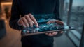 Person interacting with futuristic digital interface on tablet Royalty Free Stock Photo