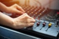 Close up hands tuning of sound mixer at control room Royalty Free Stock Photo