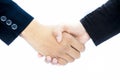 Close up of hands of two different business mans isolated on white shaking hands concept of dealing.