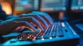 close up of hands typing on backlit keyboard for coding and programming Royalty Free Stock Photo