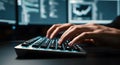 Close up of hands typing on glowing keyboard in front of computer monitors Royalty Free Stock Photo