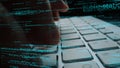 Close-up of Hands Typing on Keyboard with Code and Data in Background, Symbolizing Programming, Technology, and Digital Royalty Free Stock Photo