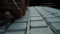 Close-Up of Hands Typing on Keyboard with Coding Lines in Background, Showcasing Programming, Technology, and Digital Royalty Free Stock Photo