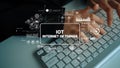 Close-up of Hands Typing on Keyboard with Graphs and Icons Representing Internet of Things Technology Concepts and Data Royalty Free Stock Photo