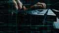 Close-up of Hands Typing on Keyboard Surrounded by Digital Code and Programming Data in a Modern Technology Environment Royalty Free Stock Photo