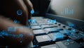 Close-Up of Hands Typing on a Keyboard Surrounded by Digital Data Visualizations and Graphs Representing Technology and Royalty Free Stock Photo