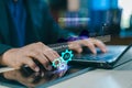 Close-up of hands typing on laptop with artificial intelligence interface,data analytics dashboard,and digital automation concept Royalty Free Stock Photo