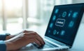 Close up of hands typing on laptop with chatbot icons displayed on screen showcasing technology and communication image conveys Royalty Free Stock Photo