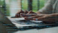 Close-Up of Hands Typing on Laptop with Complex Code Overlay Depicting Technology, Programming, and Digital Work Concept Royalty Free Stock Photo
