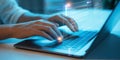 Close-up of hands typing on a laptop with glowing digital code and data overlay computer Royalty Free Stock Photo