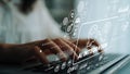 Close-up of hands typing on laptop keyboard with digital AI integration graphics overlay for technology and innovation Royalty Free Stock Photo