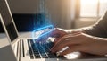 Person typing on laptop with UPDATING button and binary code overlay Royalty Free Stock Photo