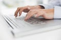 Close up of hands typing on laptop keyboard Royalty Free Stock Photo