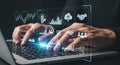 Person typing on laptop with digital business and technology icons overlay Royalty Free Stock Photo