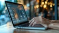 Close up of hands typing on a laptop in a modern workspace, illustrating digital communication. Royalty Free Stock Photo