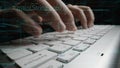 Close-Up of Hands Typing on Modern Keyboard with Code Overlay and Digital Elements Representing Programming and Royalty Free Stock Photo