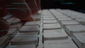 Close-up of Hands Typing on a Modern Keyboard with Digital Code Overlay, Showcasing Technology, Programming, and Data Royalty Free Stock Photo