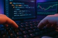 Hands Typing Python Trading Bot Code with Stock Chart on Dual Monitors Under Neon Lighting Royalty Free Stock Photo