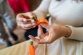 Close up on hands of unknown caucasian woman making decorative products at home leisure activity hobby arts and crafts