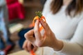 Close up on hands of unknown caucasian woman making decorative products at home leisure activity hobby arts and crafts