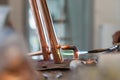 Close up on hands of unknown industrial worker plumber with central heating copper pipes welding using gas torch or blowtorch at Royalty Free Stock Photo