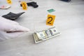 Close up on hands of unknown man forensic police investigator collecting evidence in the plastic bag at the crime scene Royalty Free Stock Photo