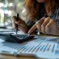 Close Up of Hands Using a Calculator