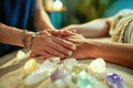 Close-up of hands using crystal therapy on a client