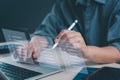Close-up of hands using a futuristic interface for task management, and digital checklist satisfaction on a laptop