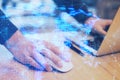 Close up of hands using laptop and mouse with glowing blue map hologram and digital data concept on blurry office desktop Royalty Free Stock Photo