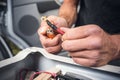 Close up of hands using heat shrink tubing on a cable with a cable lug Royalty Free Stock Photo